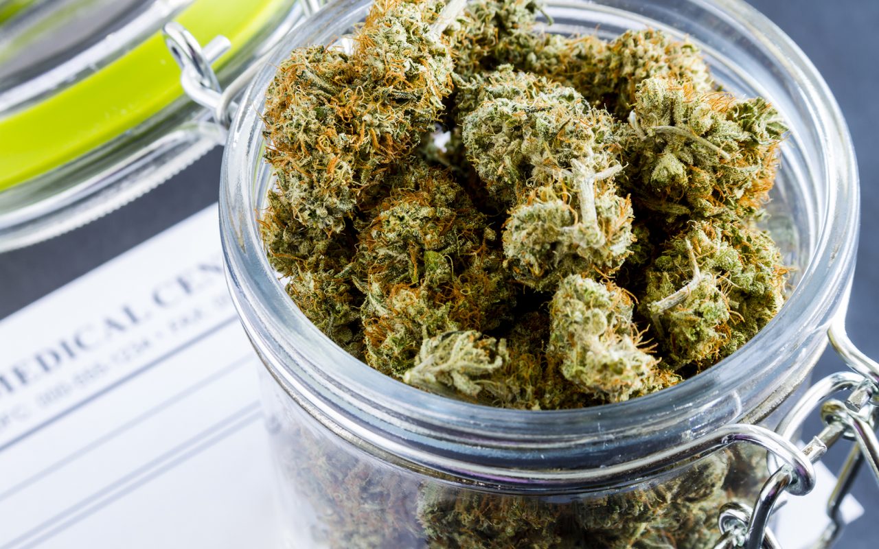 Cannabis buds in a glass container