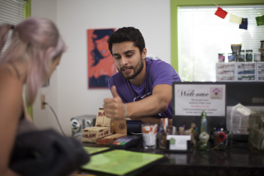 Charlie the Herbs House budtender selling Leafly GG (f.k.a Gorilla Glue) pre-rolls for the Thrift Store Cannabis Challenge