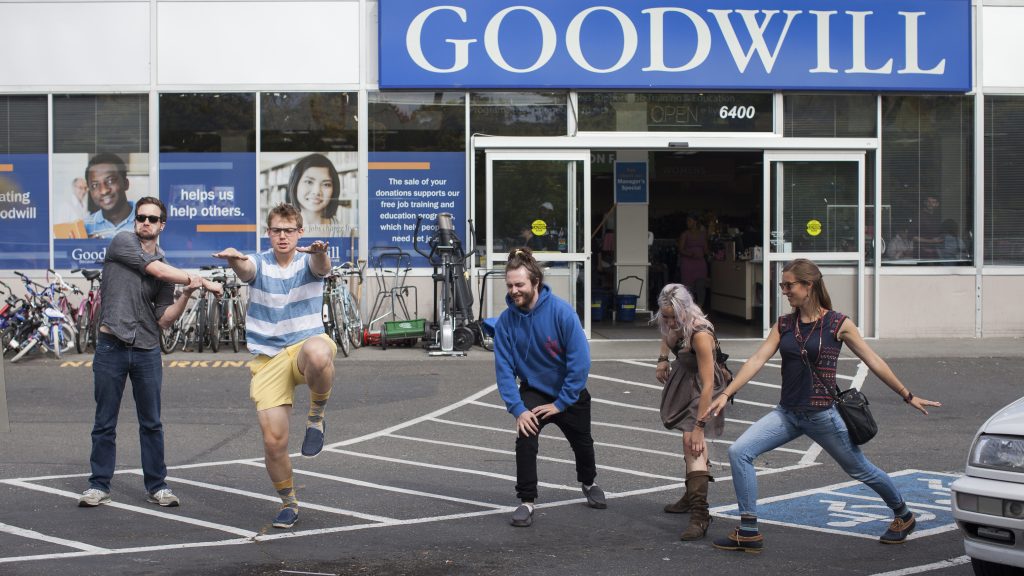 Leafly employees stretching before the Thrift Store Cannabis Challenge
