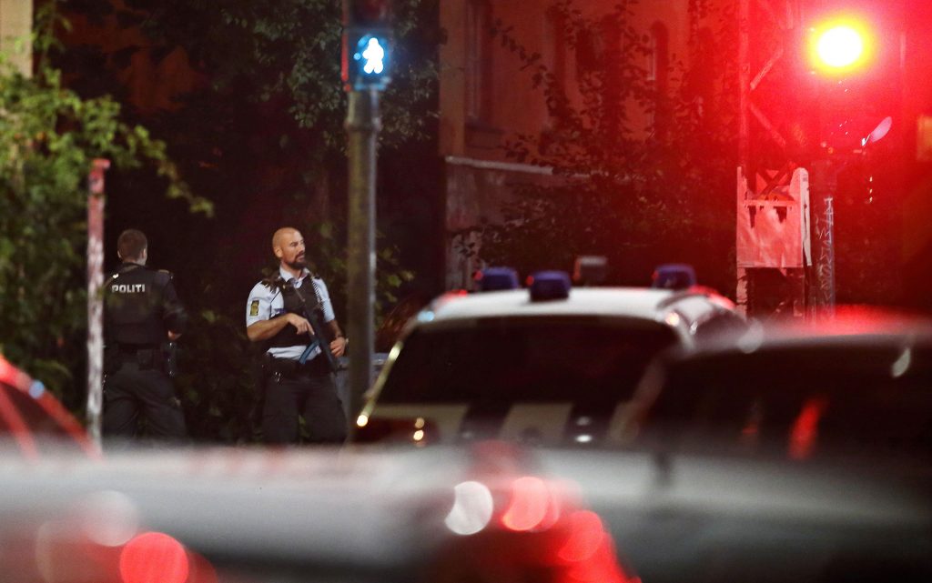 Danish police officer on patrol near Christiania in Copenhagen, Denmark, late night Wednesday, Aug. 31, 2016. Police say they have shot and critically wounded an armed Danish man following an earlier Copenhagen shootout that left two officers and a bystander wounded. (Jens Dresling/ Polfoto via AP)