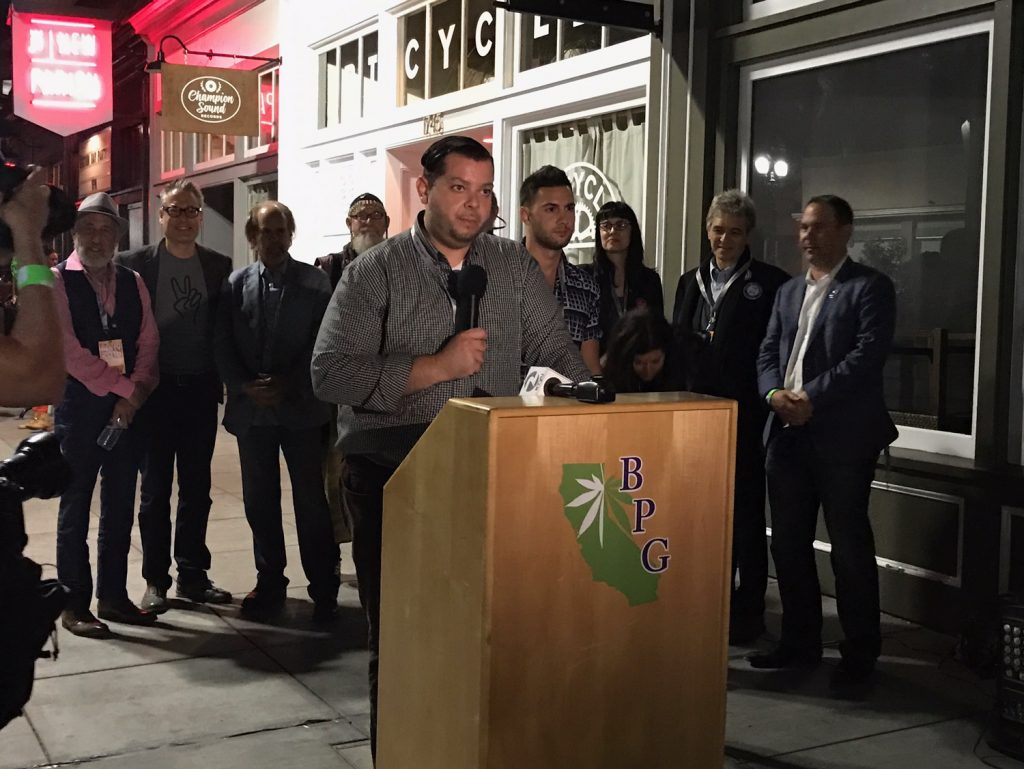 Outside a packed club in Oakland, Victor Pihno and other Prop. 64 backers announce that the election has been called: Recreational cannabis is officially legal in California. (Photo courtesy Dani Green)