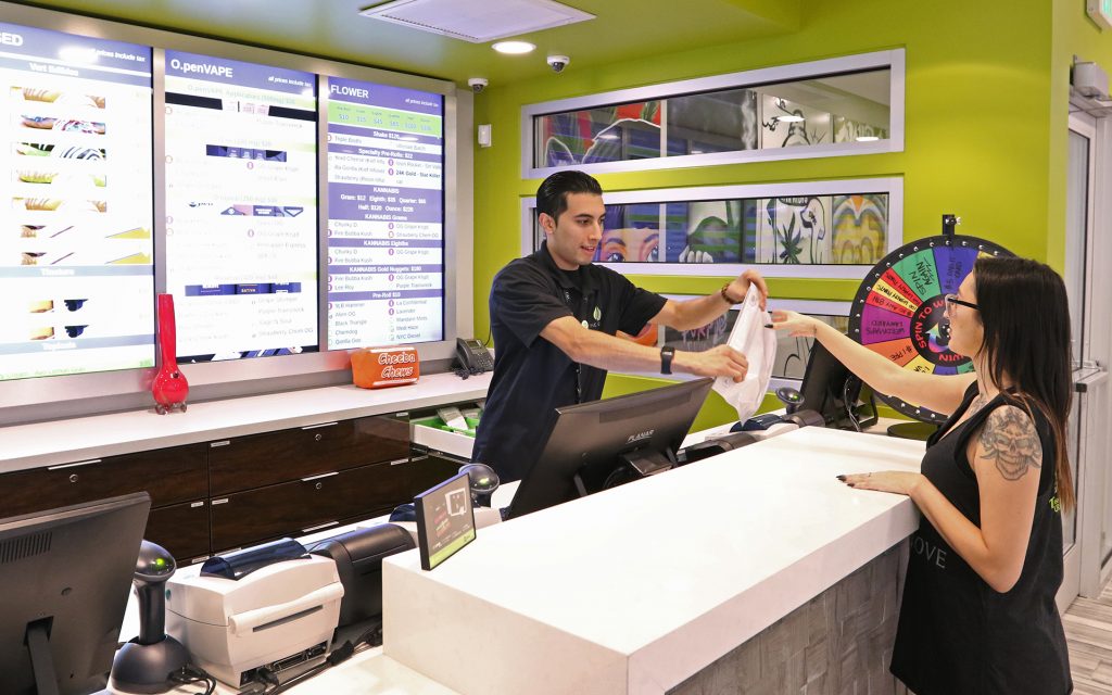 A budtender helps a customer at The Grove Wednesday, Jan. 11, 2016, in Las Vegas. (Ronda Churchill for Leafly)