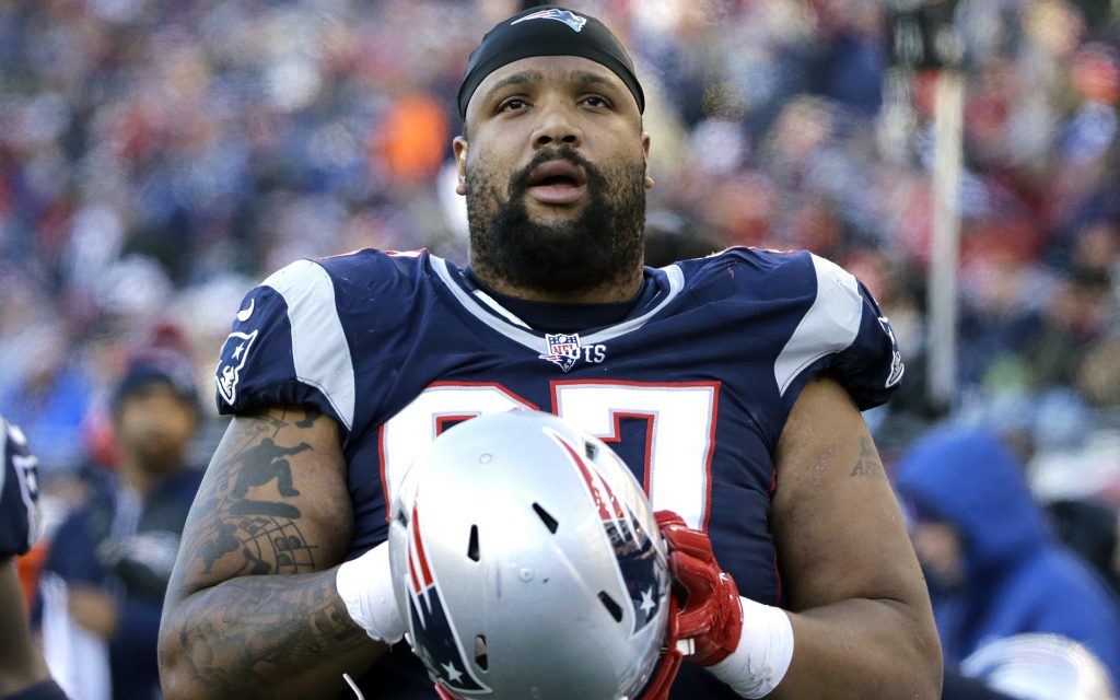 New England Patriots defensive lineman Alan Branch watches from the sideline during the second half of an NFL football game against the Los Angeles Rams, Sunday, Dec. 4, 2016, in Foxborough, Mass. (Elise Amendola/AP)