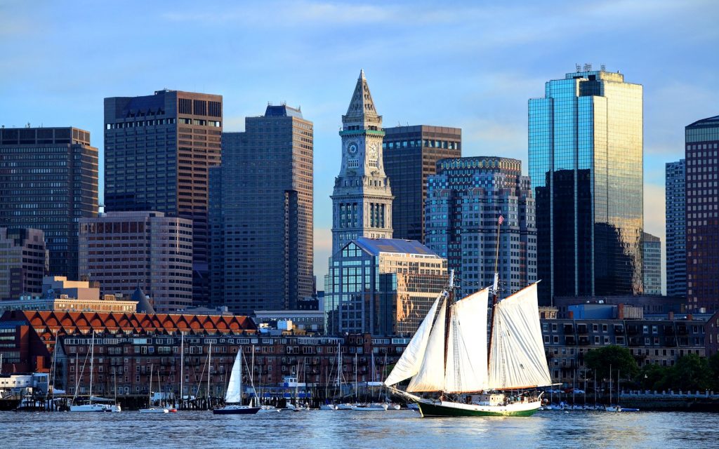 Large Schooner along the Boston Harbor Skyline.
