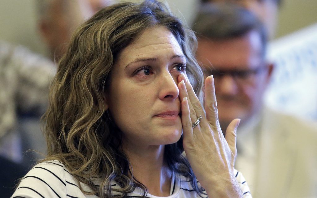 Desiree Hennessy cries during the Utah Patients Coalition news conference at the Utah State Capitol Monday, June 26, 2017, in Salt Lake City. A group of activists and Utah residents with chronic conditions has launched a ballot initiative to ask voters next year to pass a broad medical marijuana law. Her adopted son Hestevan has cerebral palsy and suffers from chronic nerve pain, seizure disorder, and life-threatening complications from his medication. (Rick Bowmer/AP)