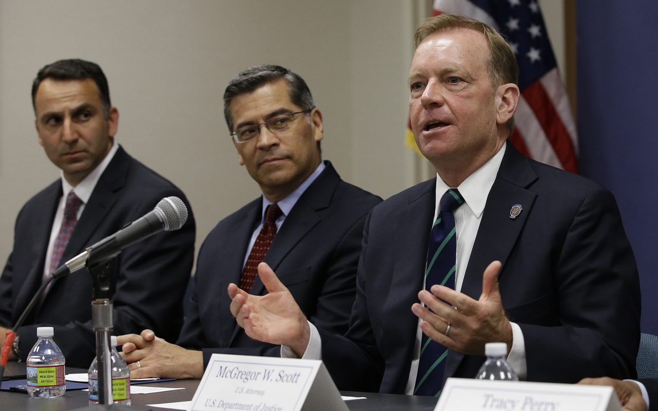 McGregor Scott, right, the United States Attorney for the Eastern District of California, flanked by California Attorney General Xavier Becerra, center, discusses an increase in the use of a banned pesticide at illegal marijuana farms hidden on public lands Tuesday, May 29, 2018, in Sacramento, Calif. Research by Mourad Gabriel, left, the executive director and senior ecologist at Integral Ecology Research Center, and his colleagues found the highly toxic pesticide Carbofuran, which can