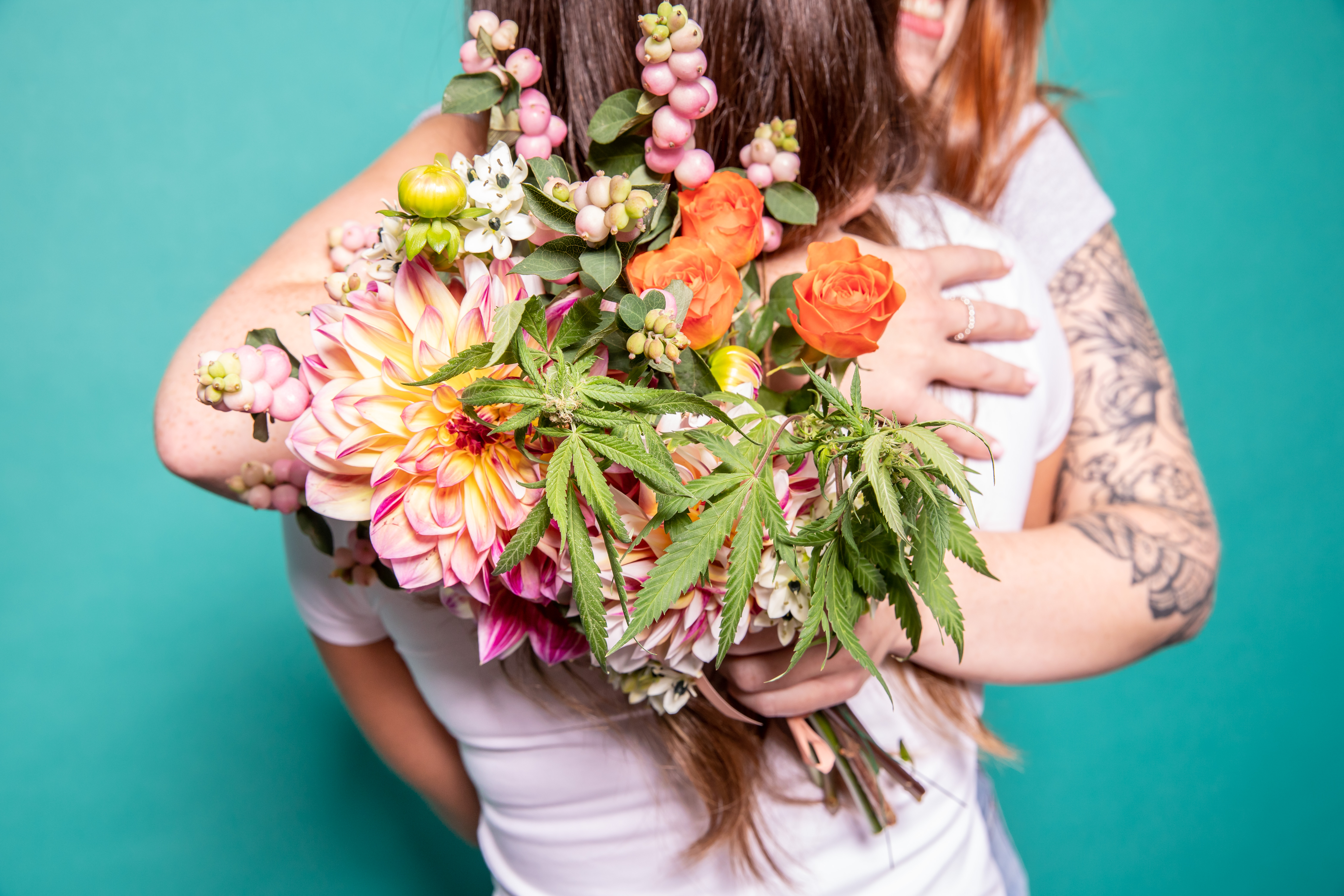 party etiquette, people hugging with bouquet of cannabis flowers